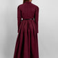 Woman wearing a high quality modest maxi dress in burgundy for graduation or special occasions, with puff sleeves and elegant cotton-blend fabric.