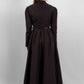 Woman wearing a high quality modest maxi dress in black for graduation or special occasions, with puff sleeves and elegant cotton-blend fabric.
