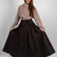 Elegant cotton maxi black skirt with subtle satin sheen and hidden side pockets